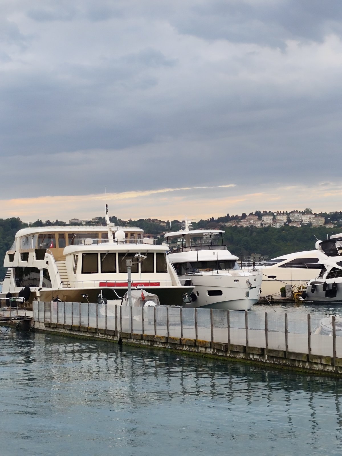 Afternoon leisure scene unfolds at Sarıyer marina under cloudy skies