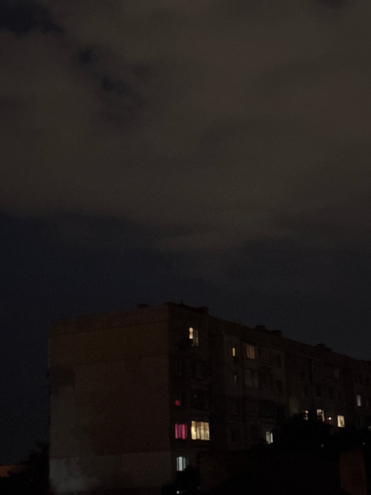 Brutalist apartment block at night in residential Sofia