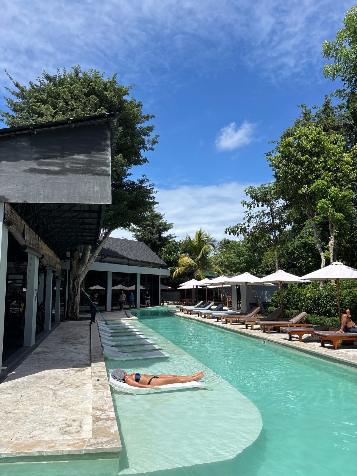 Early morning pool activities captured at Kuta Selatan resort