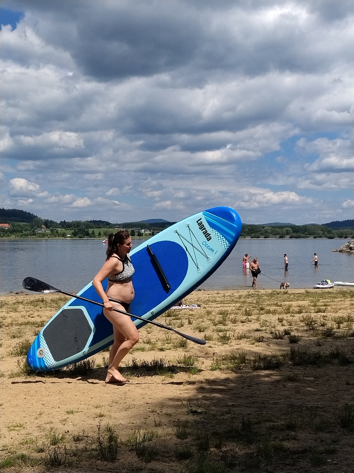 Summer day at Radslav Lake: beach, paddleboards, and easy living