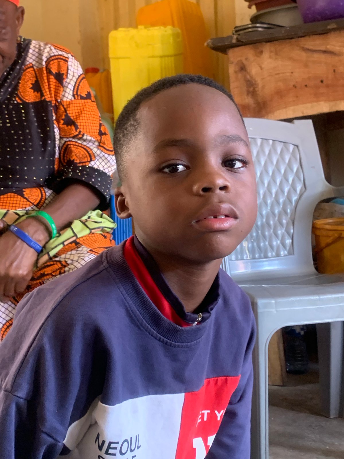 Everyday life and tailoring work inside a Jos home