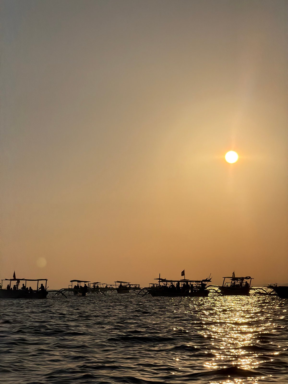 Traditional boats on the water at sunset, Buleleng, Indonesia