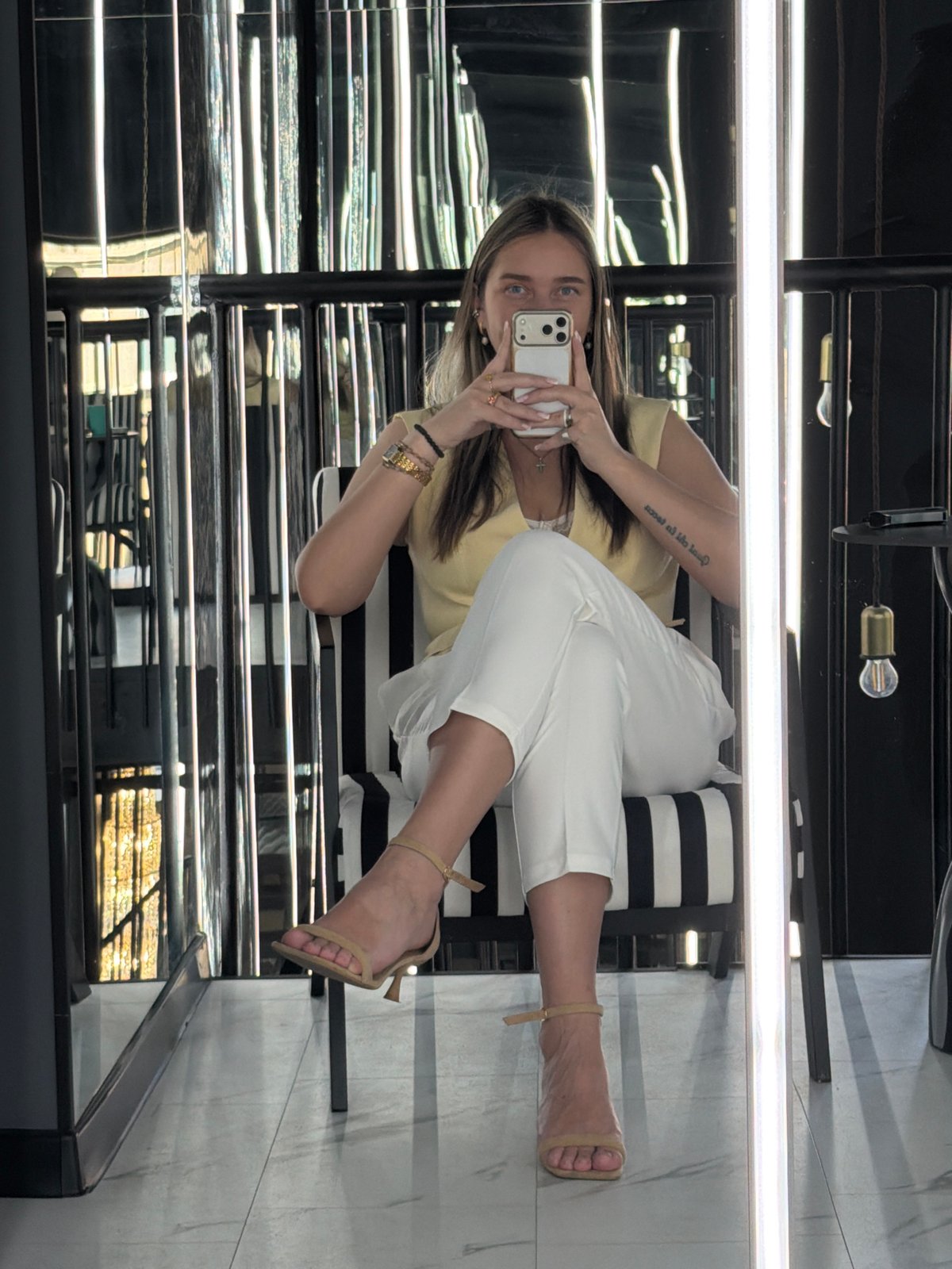 Woman takes morning selfies in yellow blazer, Moscow