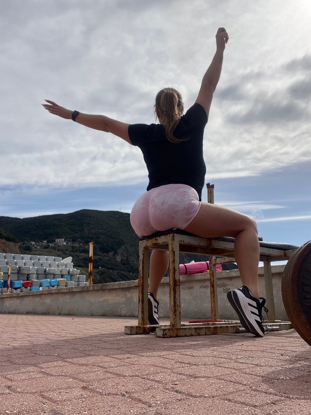 Woman performs outdoor weight training routine in Montenegro
