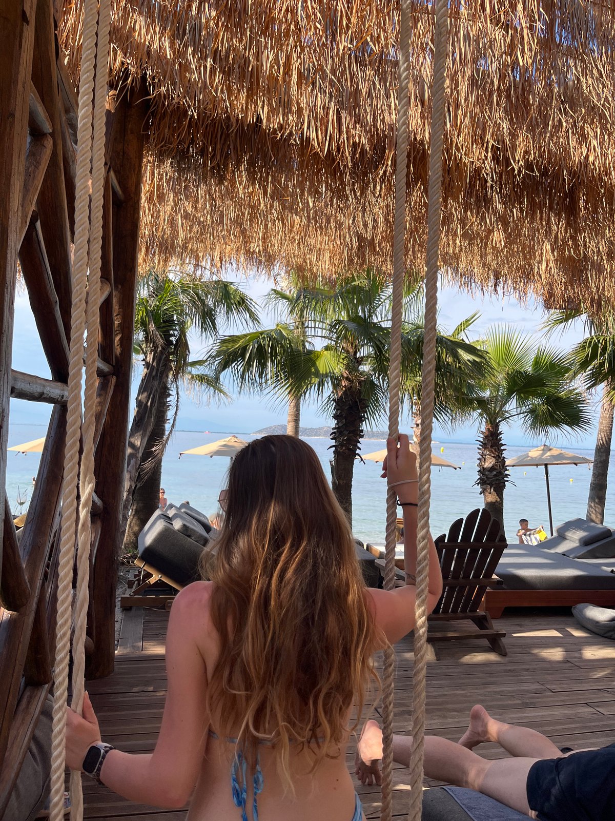 Woman enjoys afternoon at Thassos beach resort in Greece