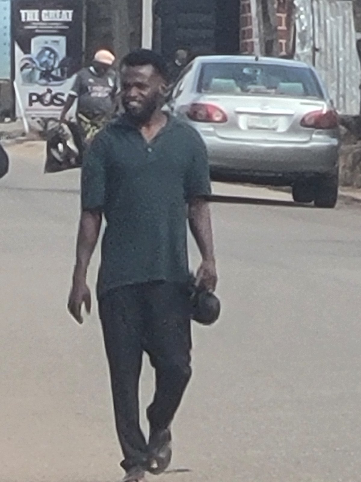 Woman in green leopard print dress spotted on Jos street