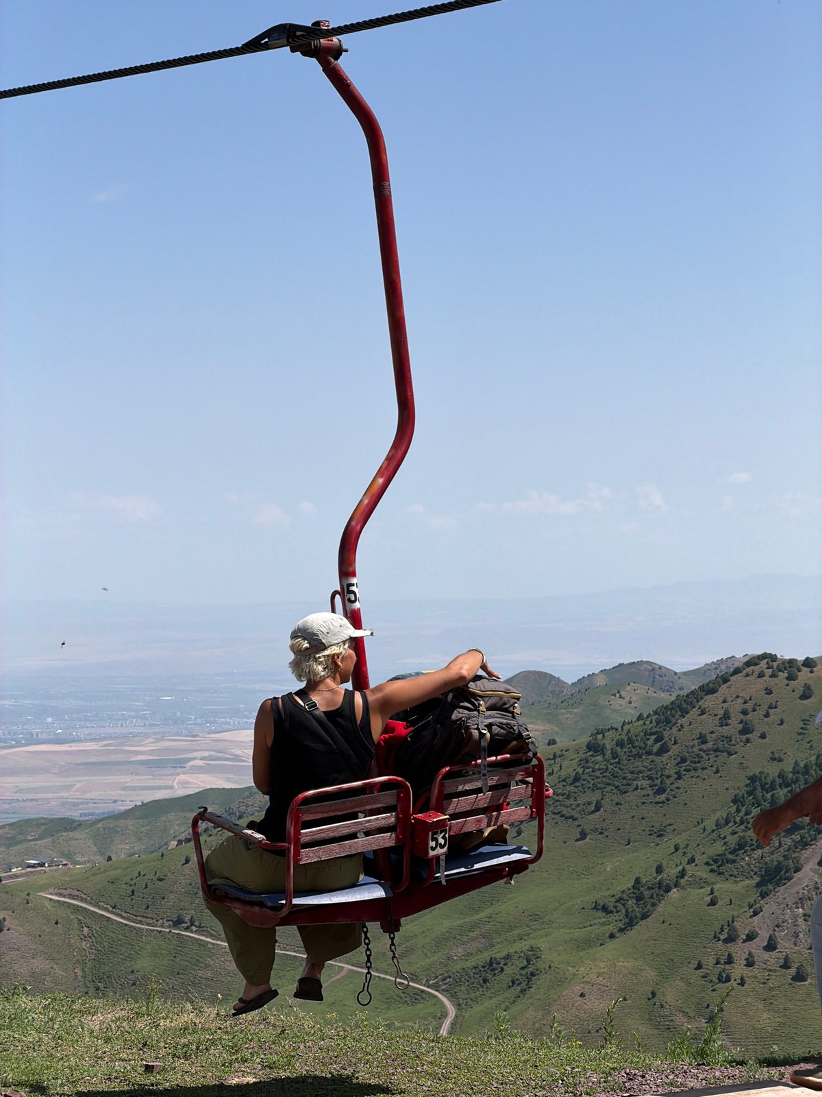 Vintage chairlift running through Kyrgyzstan's green mountain slopes