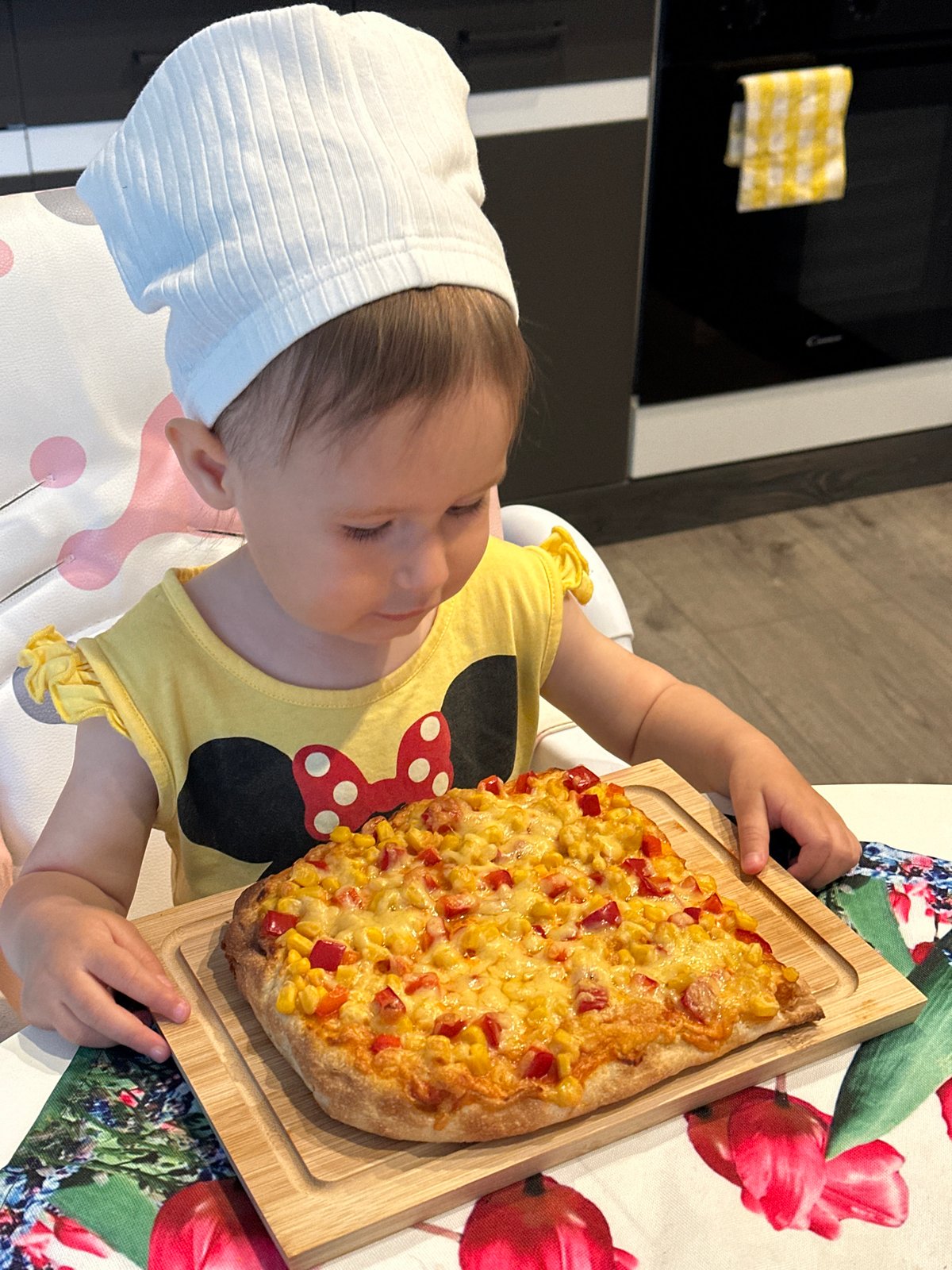 Toddler with wooden board captured in Wisła dining moment