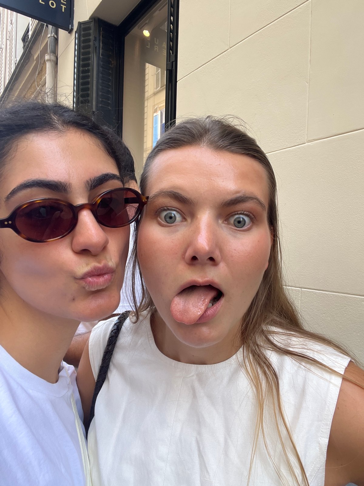 Selfie session on a cobblestone Paris street, June afternoon