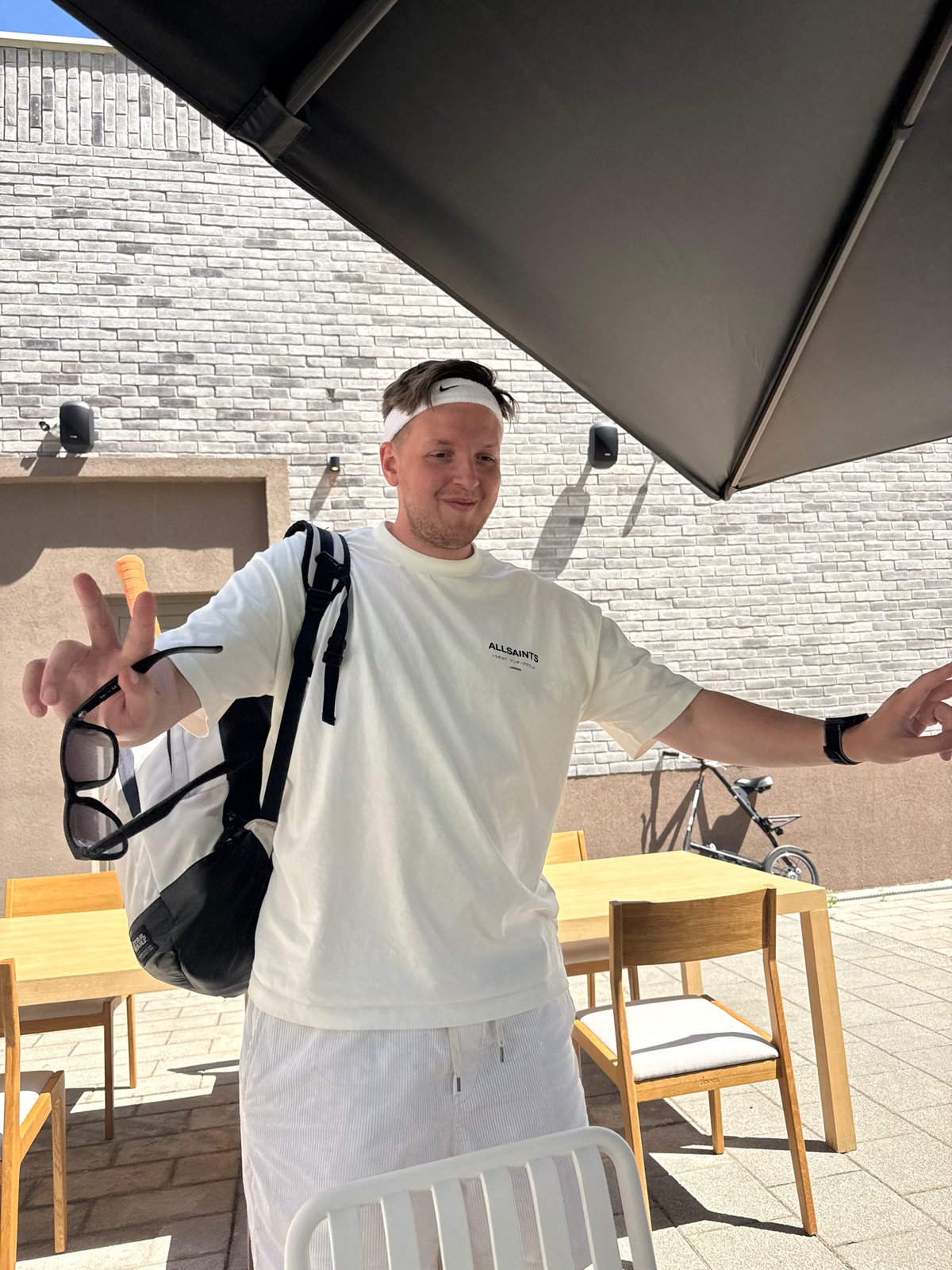 Tennis player packs up equipment at Belgrade outdoor venue
