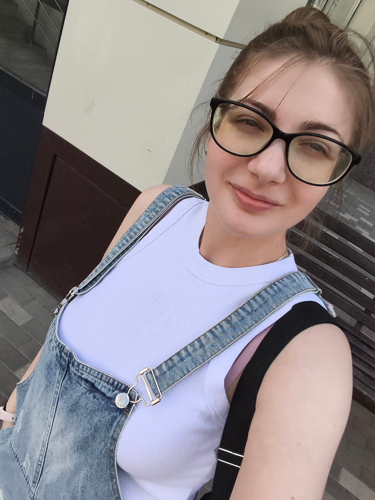 Outdoor selfie series, denim overalls and glasses, city setting