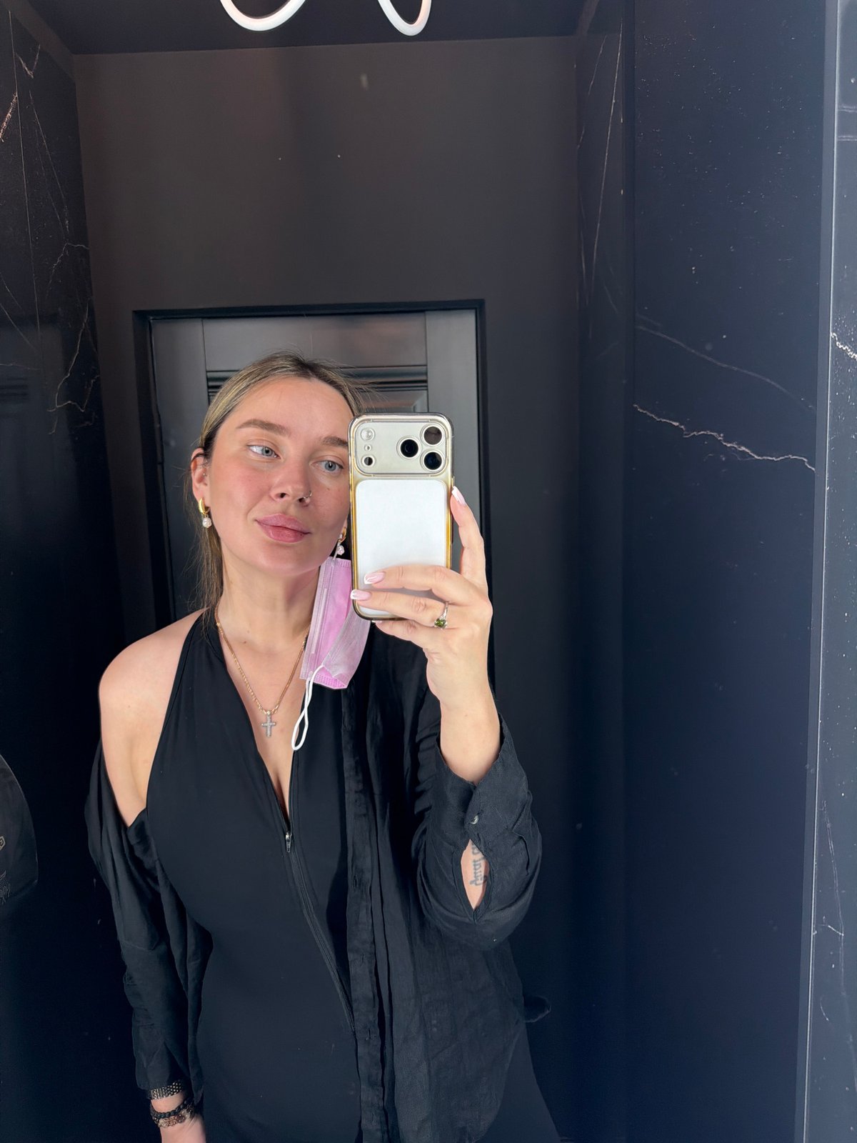 Woman takes mirror selfie with smartphone in Moscow