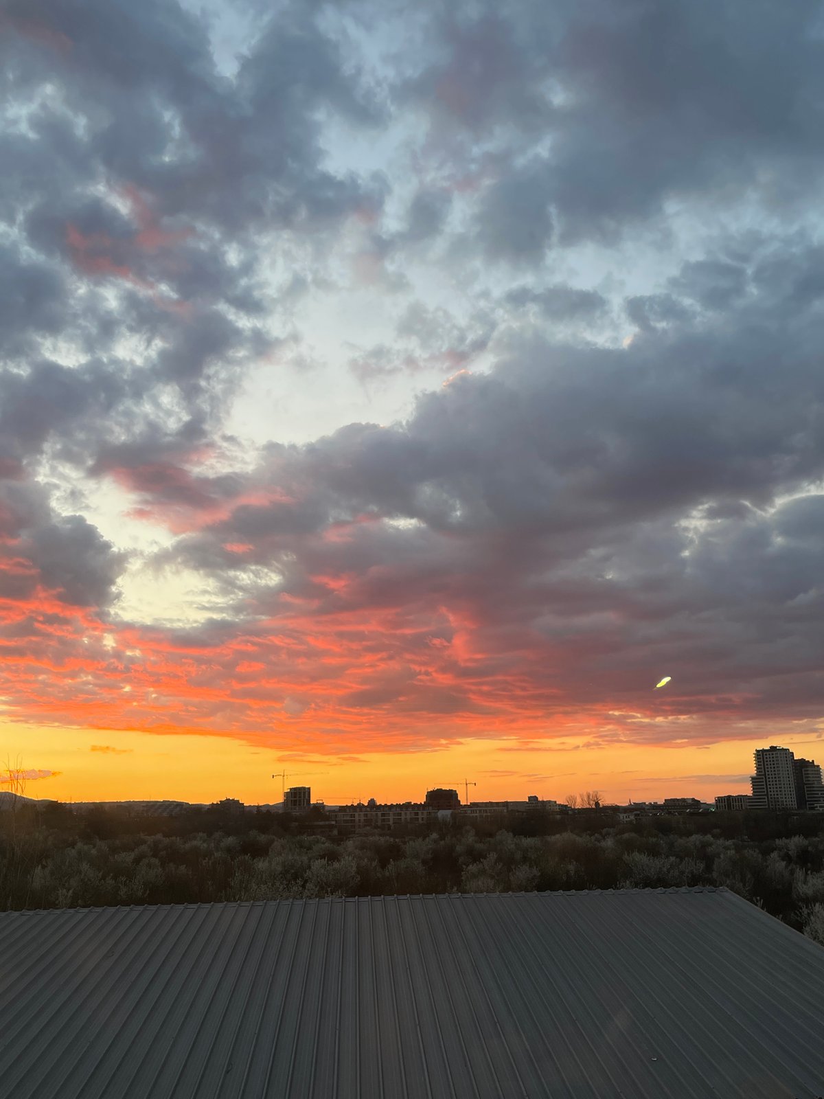 Rooftop sunset photograph captures vivid orange sky display