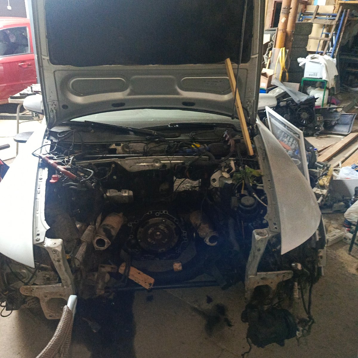 Car repair work underway in Markovskiy garage workshop