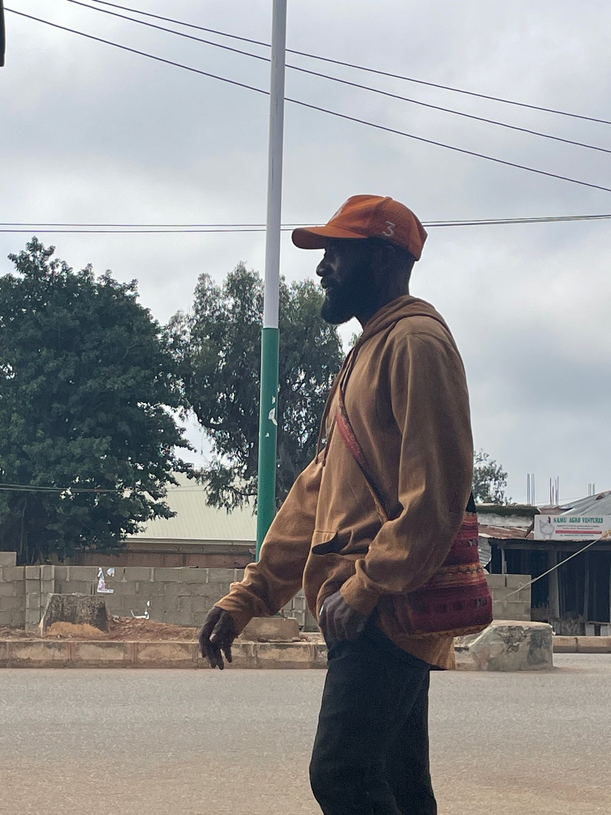 Everyday street life along a busy Bukuru road