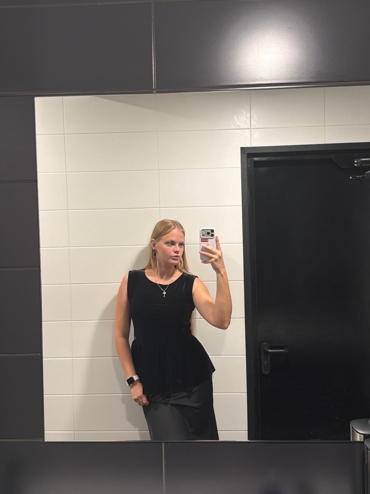 Mirror selfie session in an Izhevsk restroom, July 2026