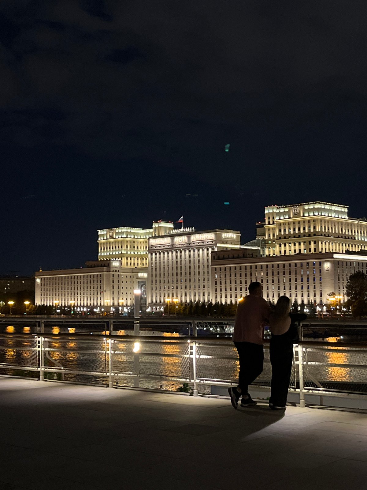 Evening photography session captures illuminated Moscow architecture and figures