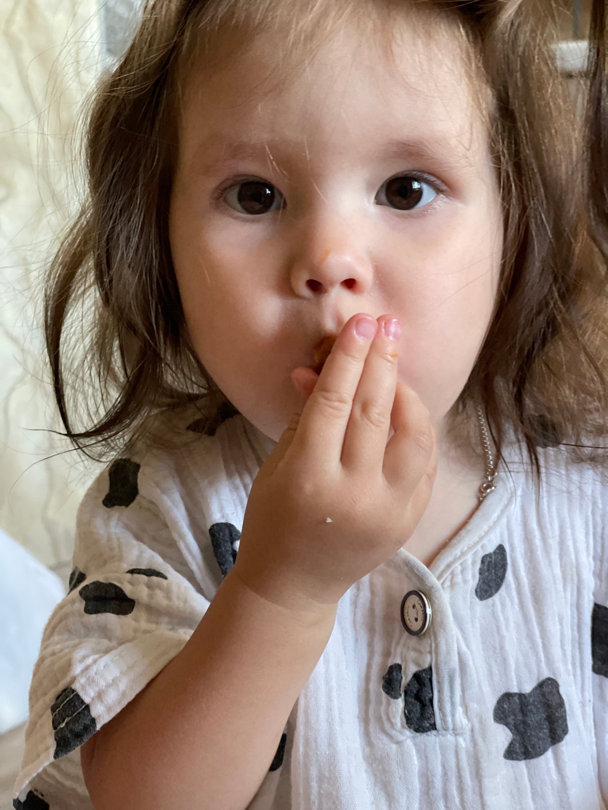 Child in cow print shirt photographed in Izhevsk