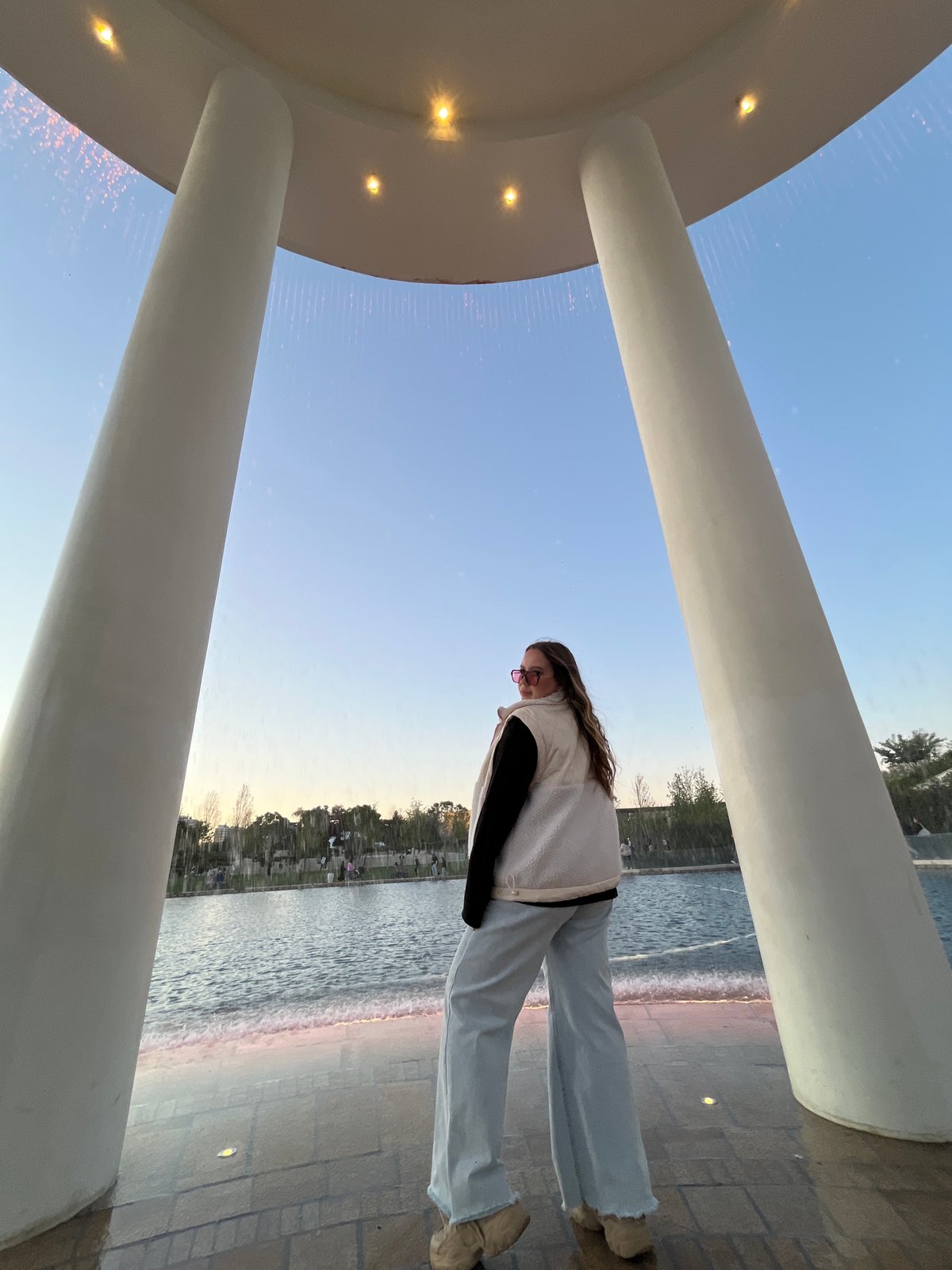 Visitors photograph at illuminated circular structure in Krasnodar