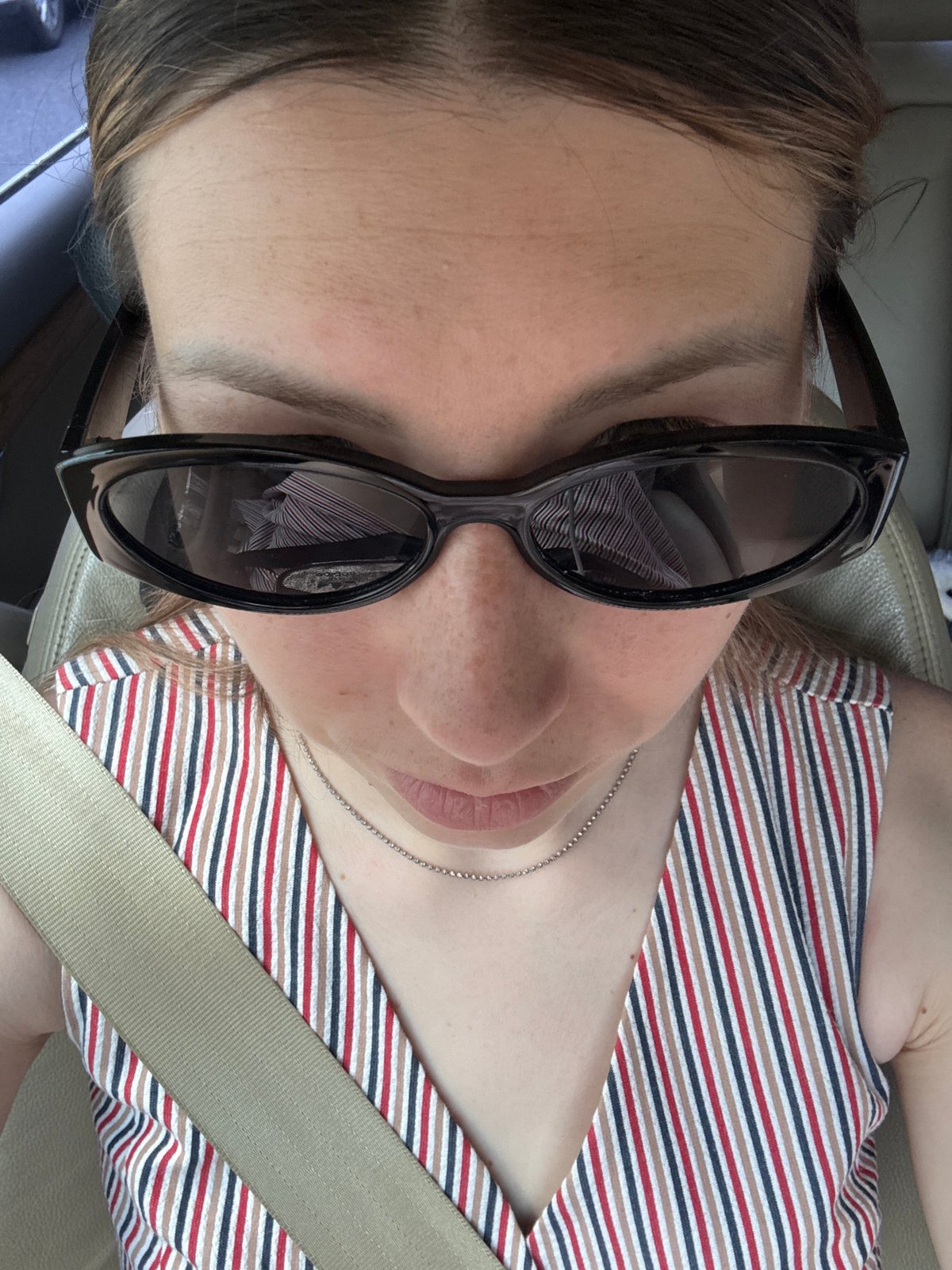 Woman in striped dress photographed in car, Balashikha