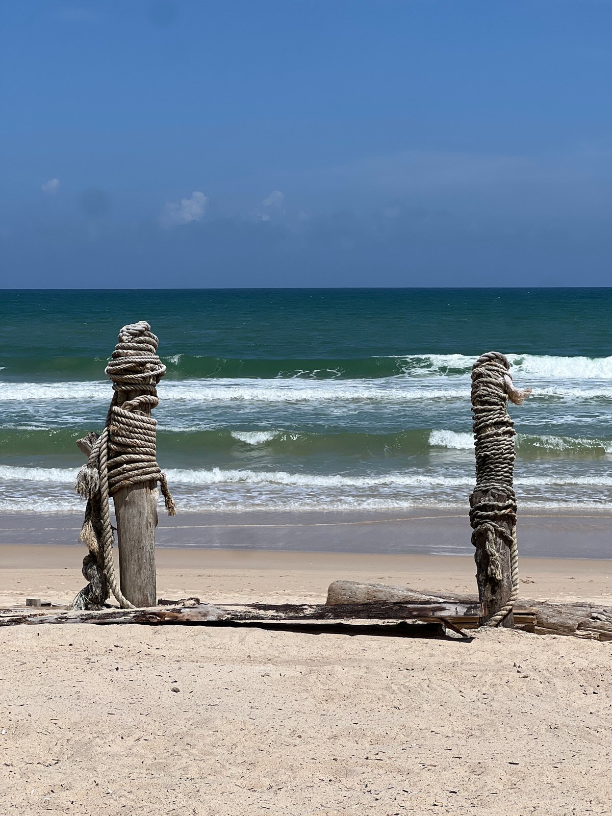 Bright day on a Choeng Thale beach with umbrellas and turquoise water