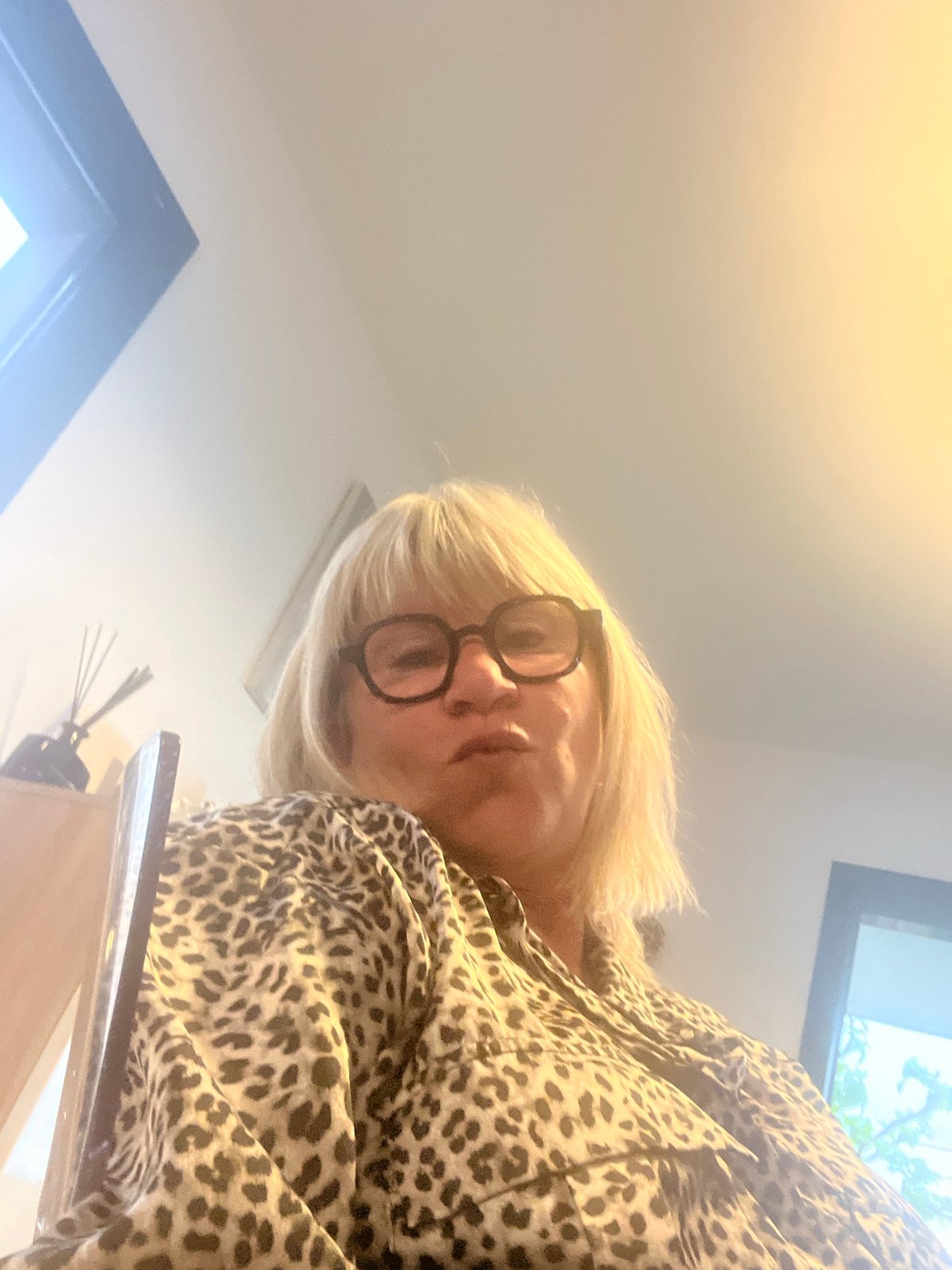 Woman takes mirror selfies in Chambœuf home