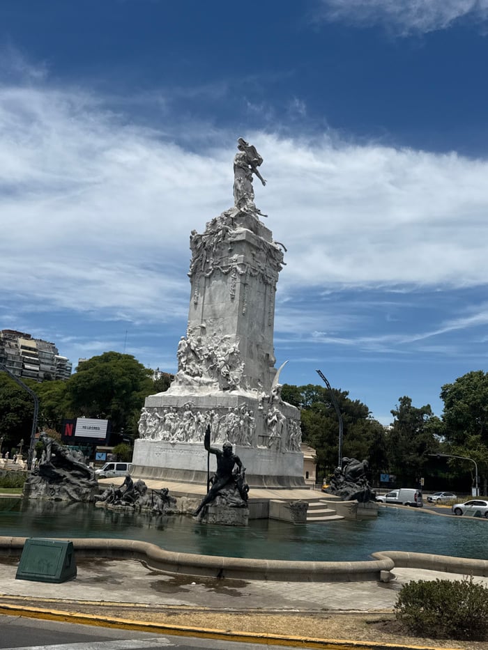 Tourist documents Buenos Aires architectural landmarks during afternoon exploration