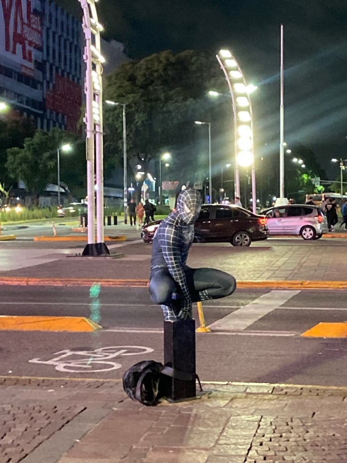Costumed figure, historic buildings captured in Buenos Aires nighttime scenes