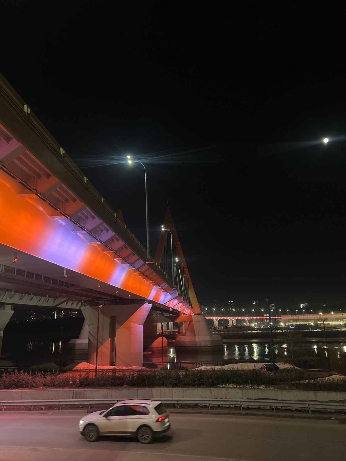 Millennium Bridge illuminated at night in Kazan, Russia
