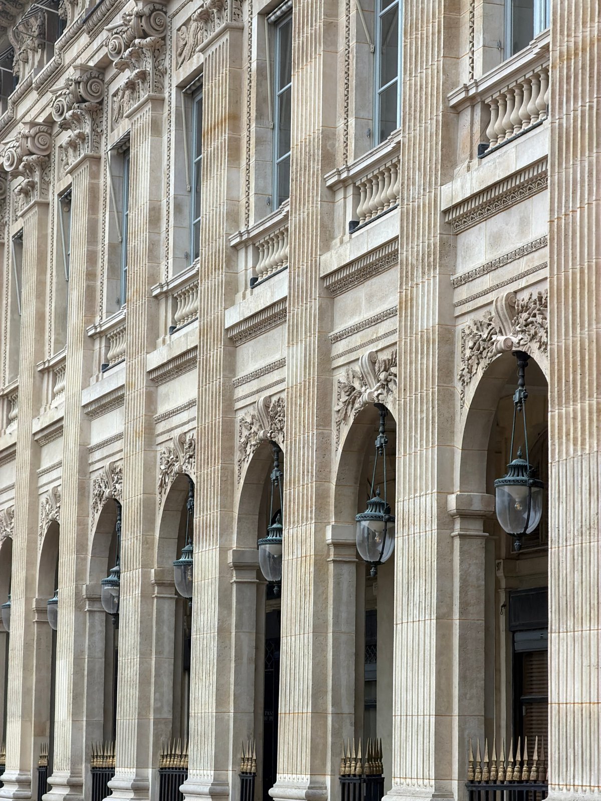 Parisians navigate daily life amid ornate architecture and cafes