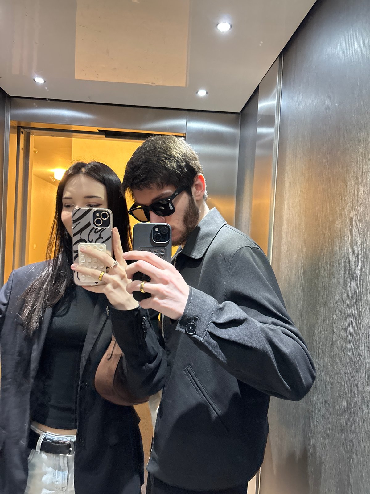 Couple takes selfies in elevator in Cachan, France