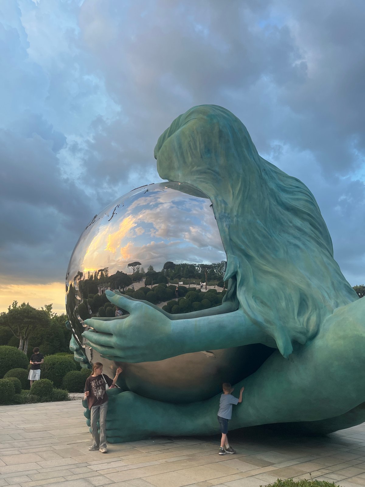 Evening visitors explore Krasnodar park amid approaching storms