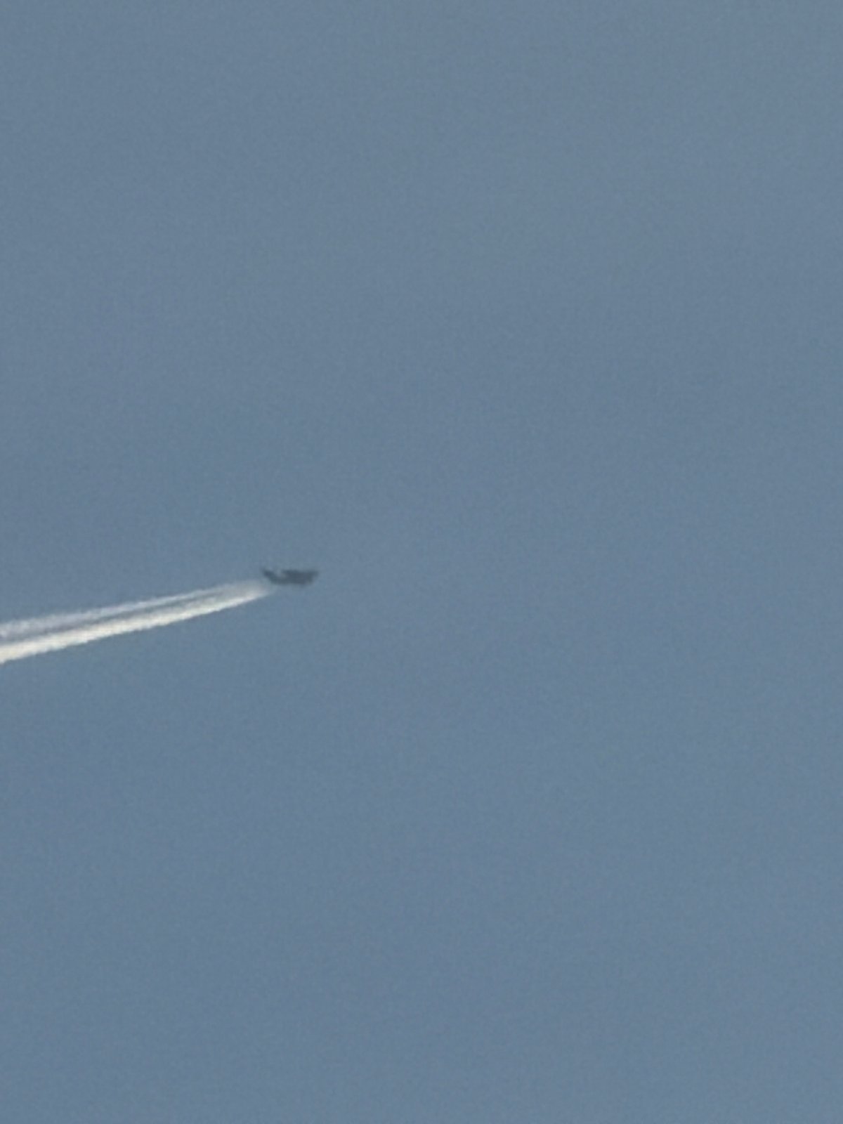 Sky watching session captures contrails and moon over Bulgarian town