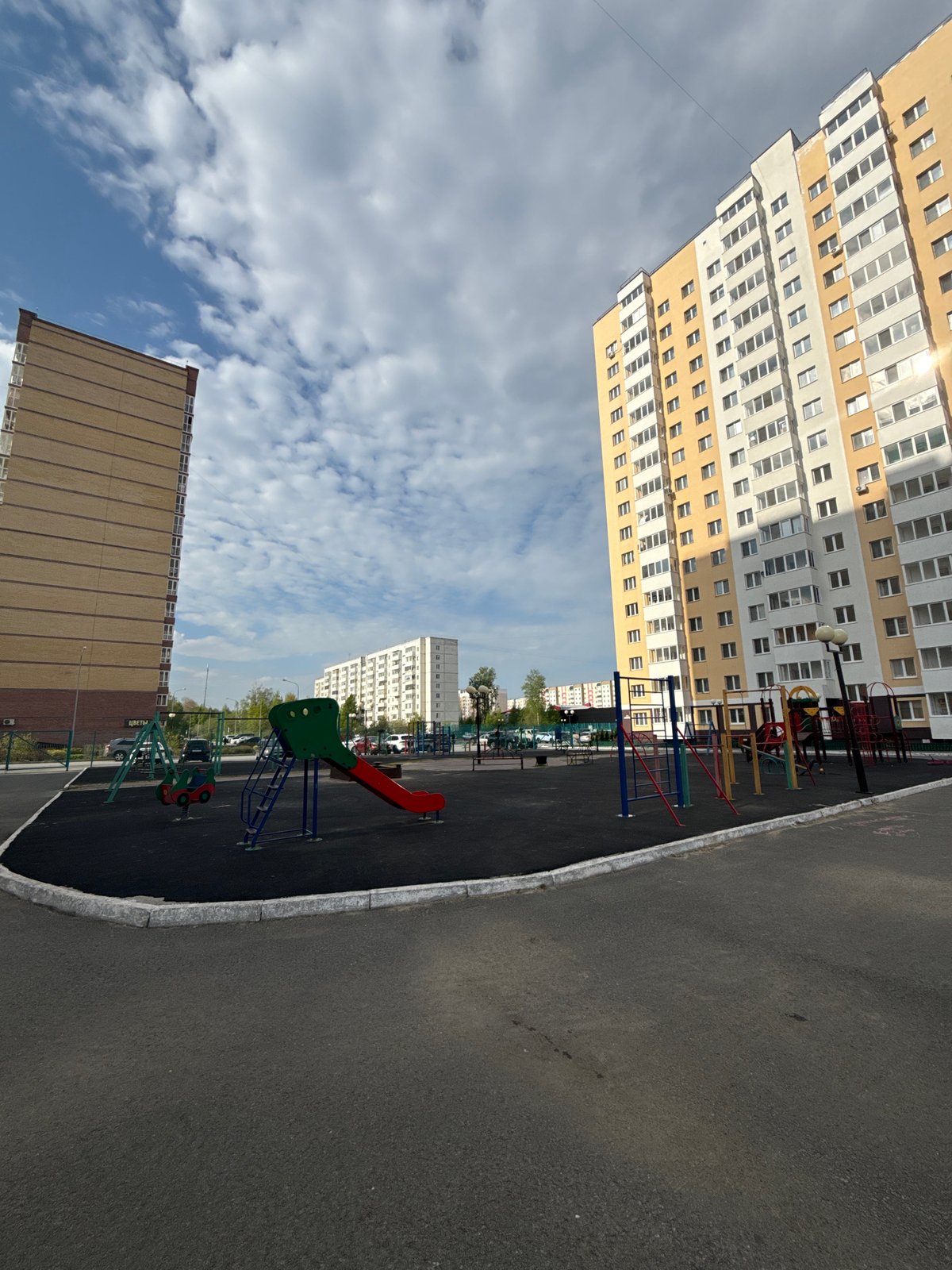 Family playground visit documented in Tobolsk residential area