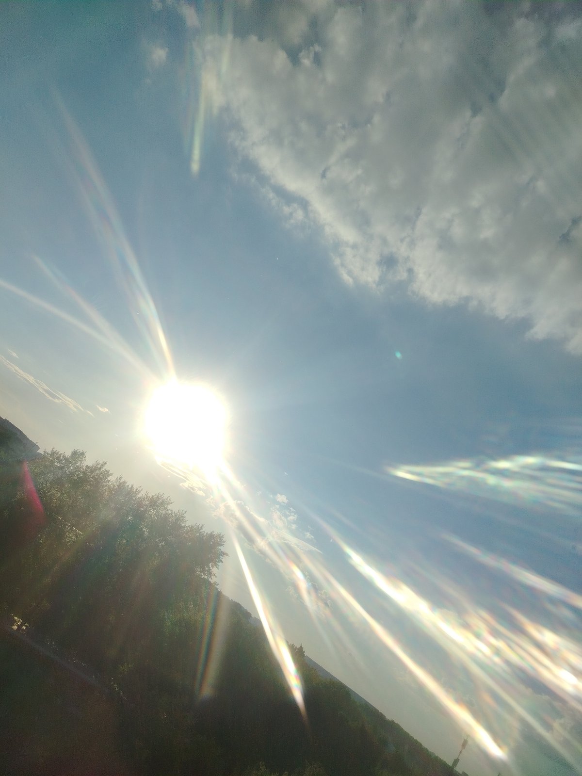 Bright sun creates lens flares over Podolsk, Russia