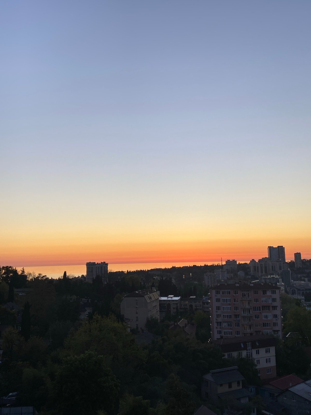 Sochi cityscape photographed during golden hour from elevated viewpoint