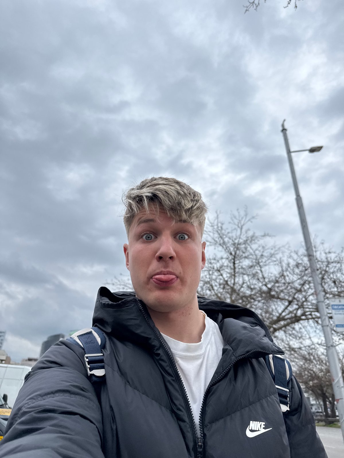 Young man walks dog, takes selfies in Plovdiv park