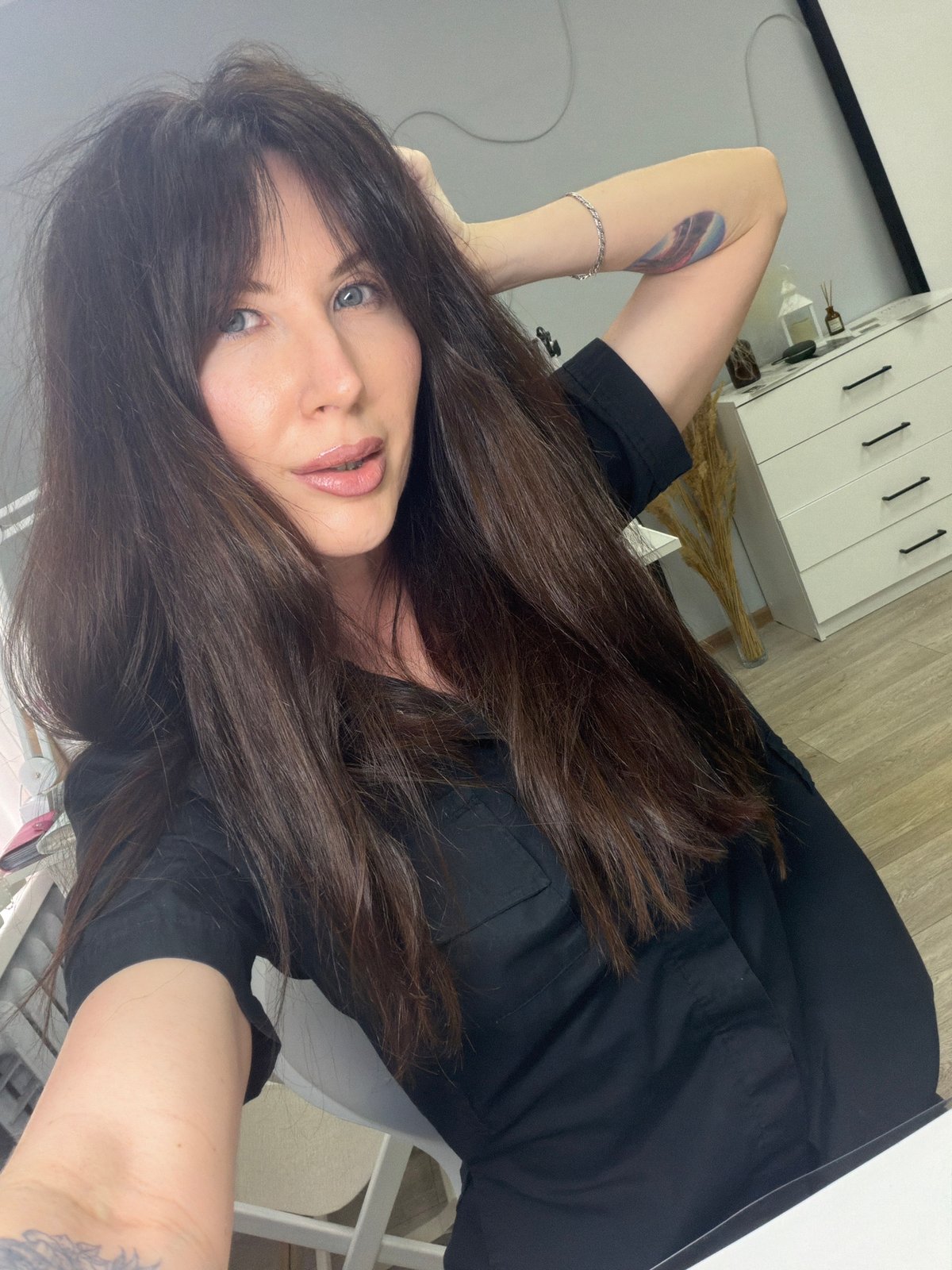 Woman Takes Multiple Selfies Indoors in Perm, Russia