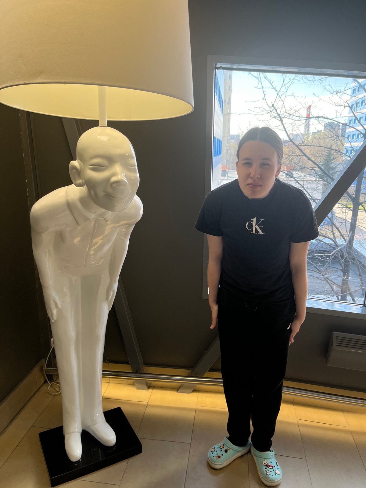 Person in casual wear spotted near decorative lamp in Moscow