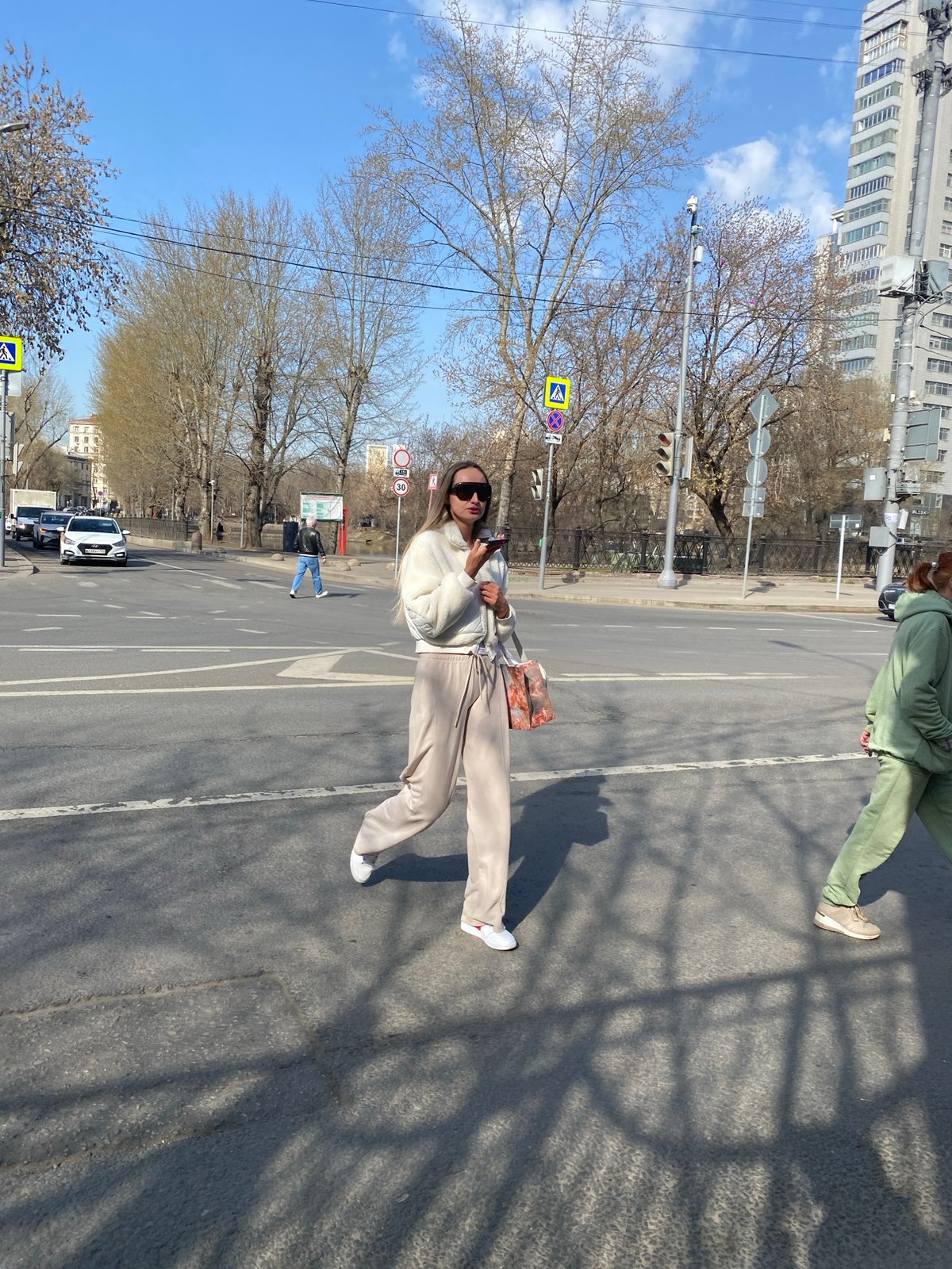 Pedestrians navigate streets and sidewalks in Khimki