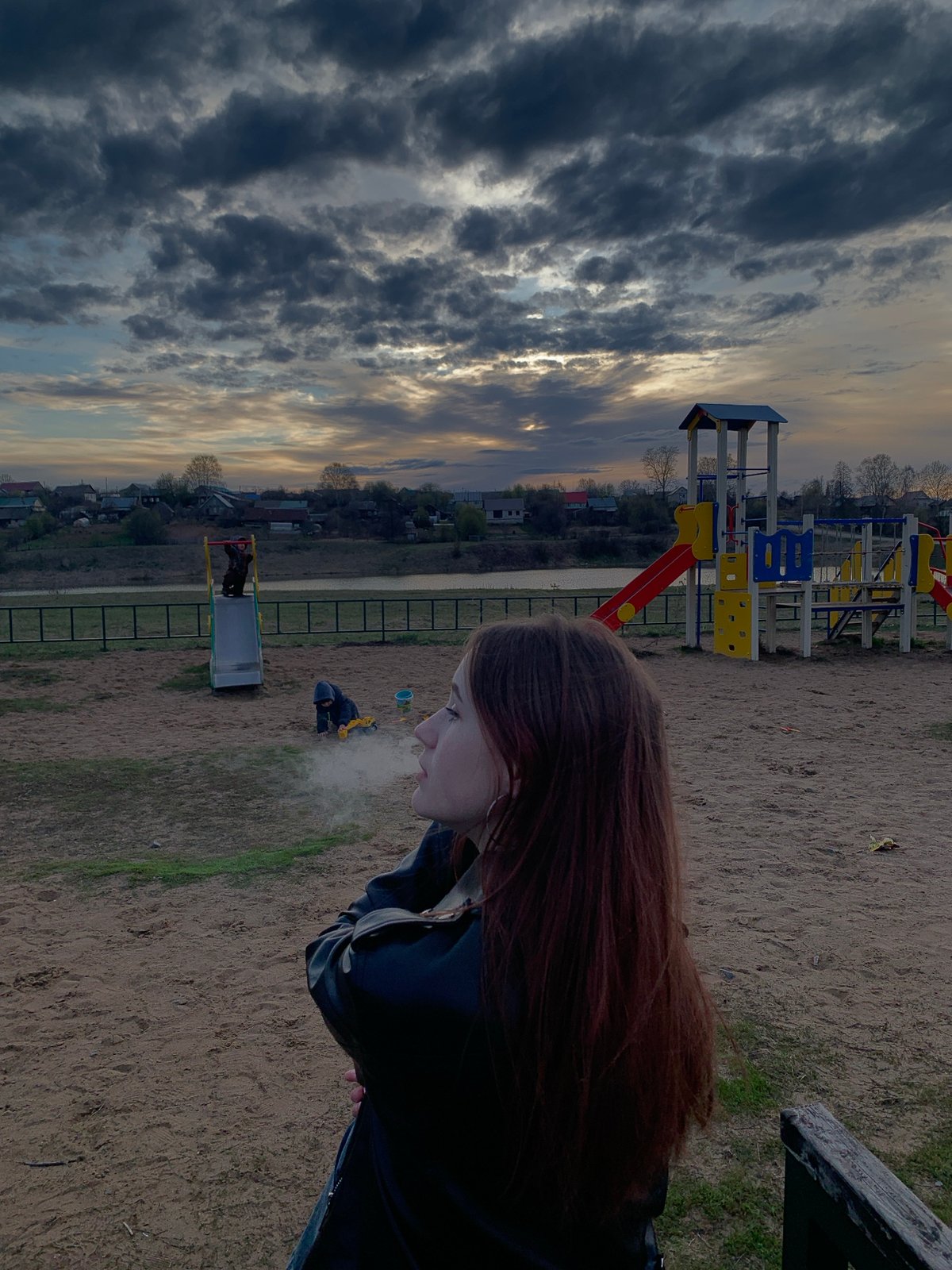 Woman documents playground visit in rural Russian town