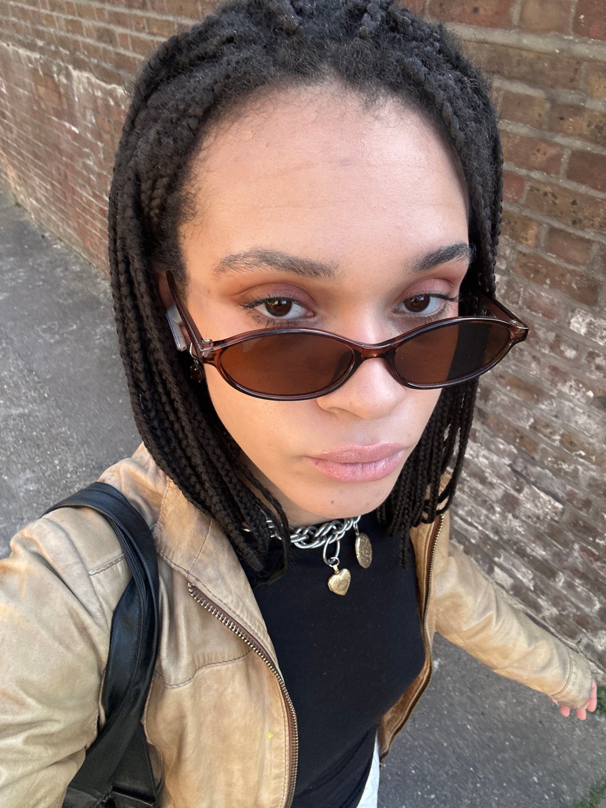 Person photographed near brick building in central London