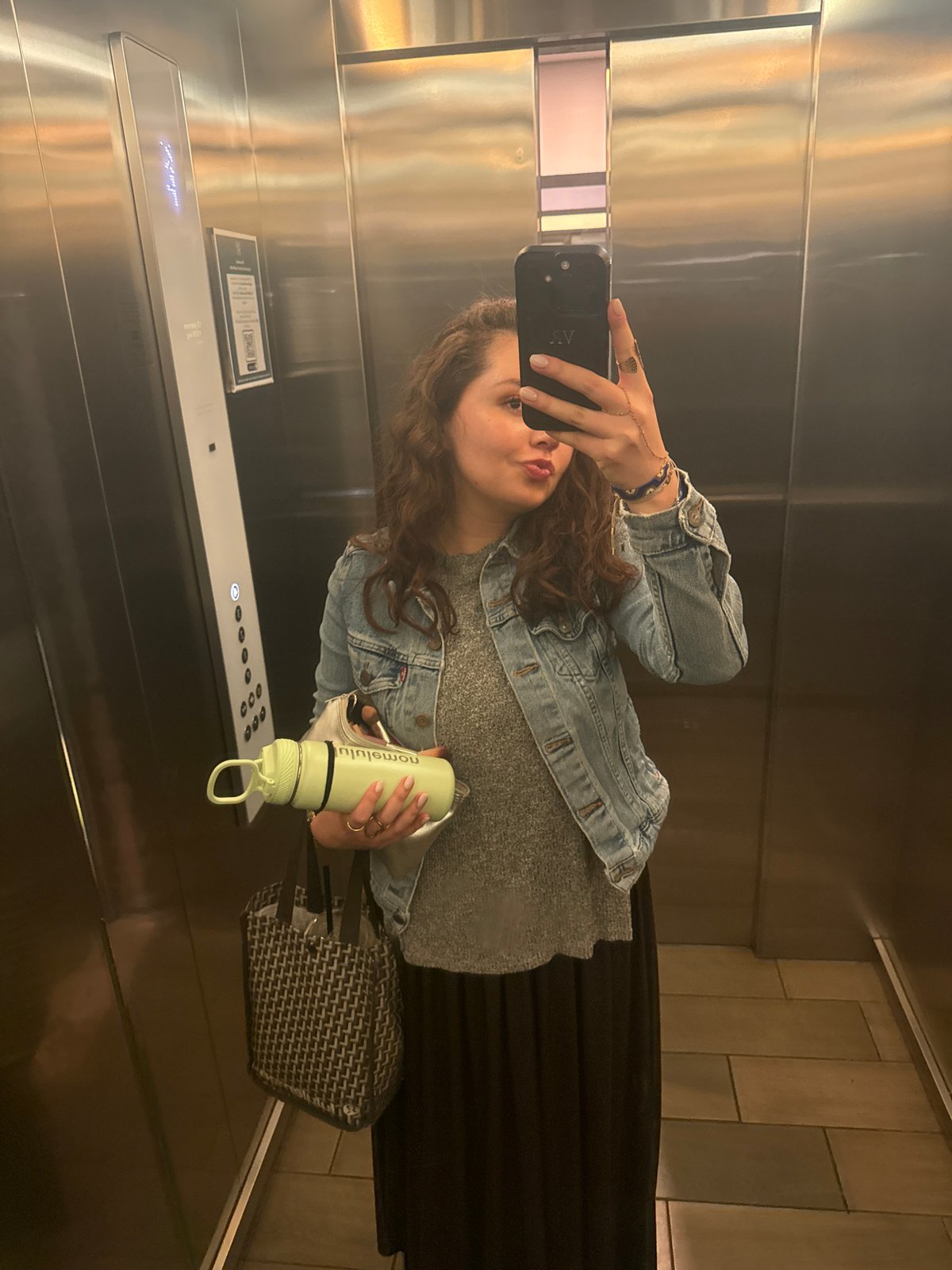 Woman takes early morning elevator selfie in Mexico City