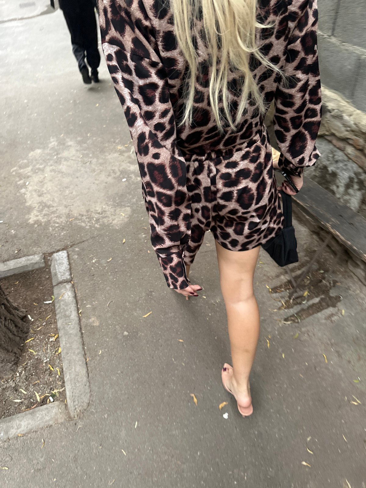 Barefoot in leopard print on a Tbilisi sidewalk