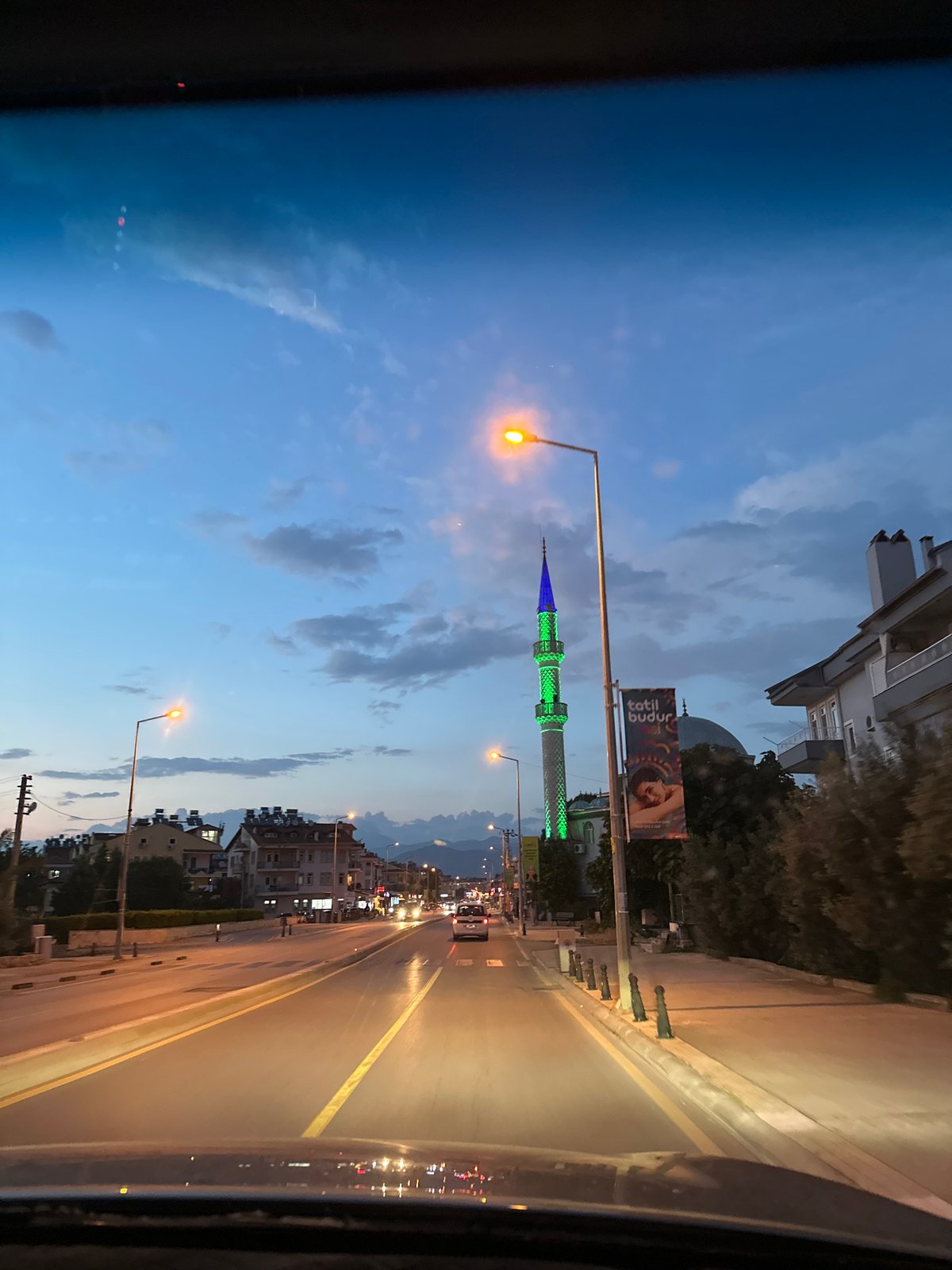 Illuminated mosque minaret observed at dusk in Fethiye