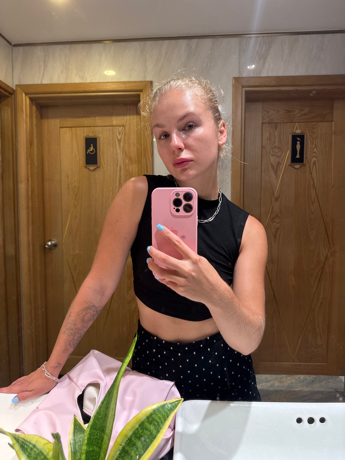 Mirror selfie in a Nha Trang restroom, July 2026