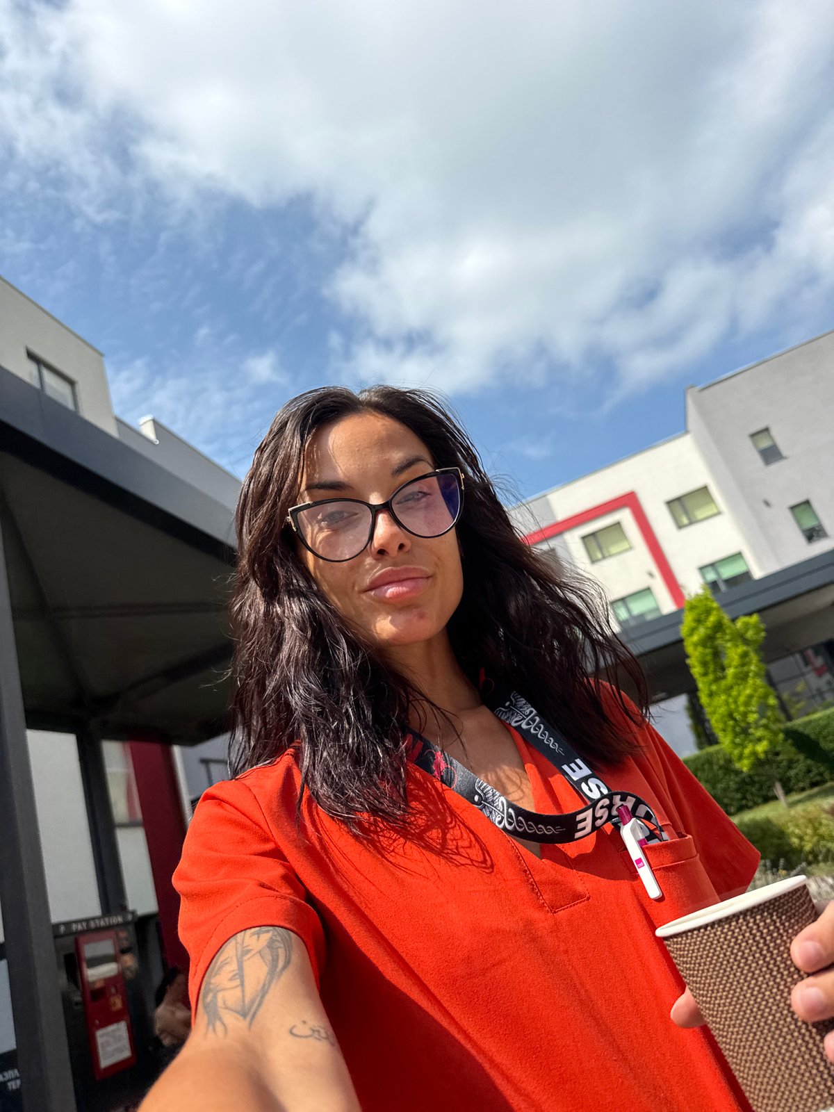 Morning coffee stop in Pleven, lanyard and orange top