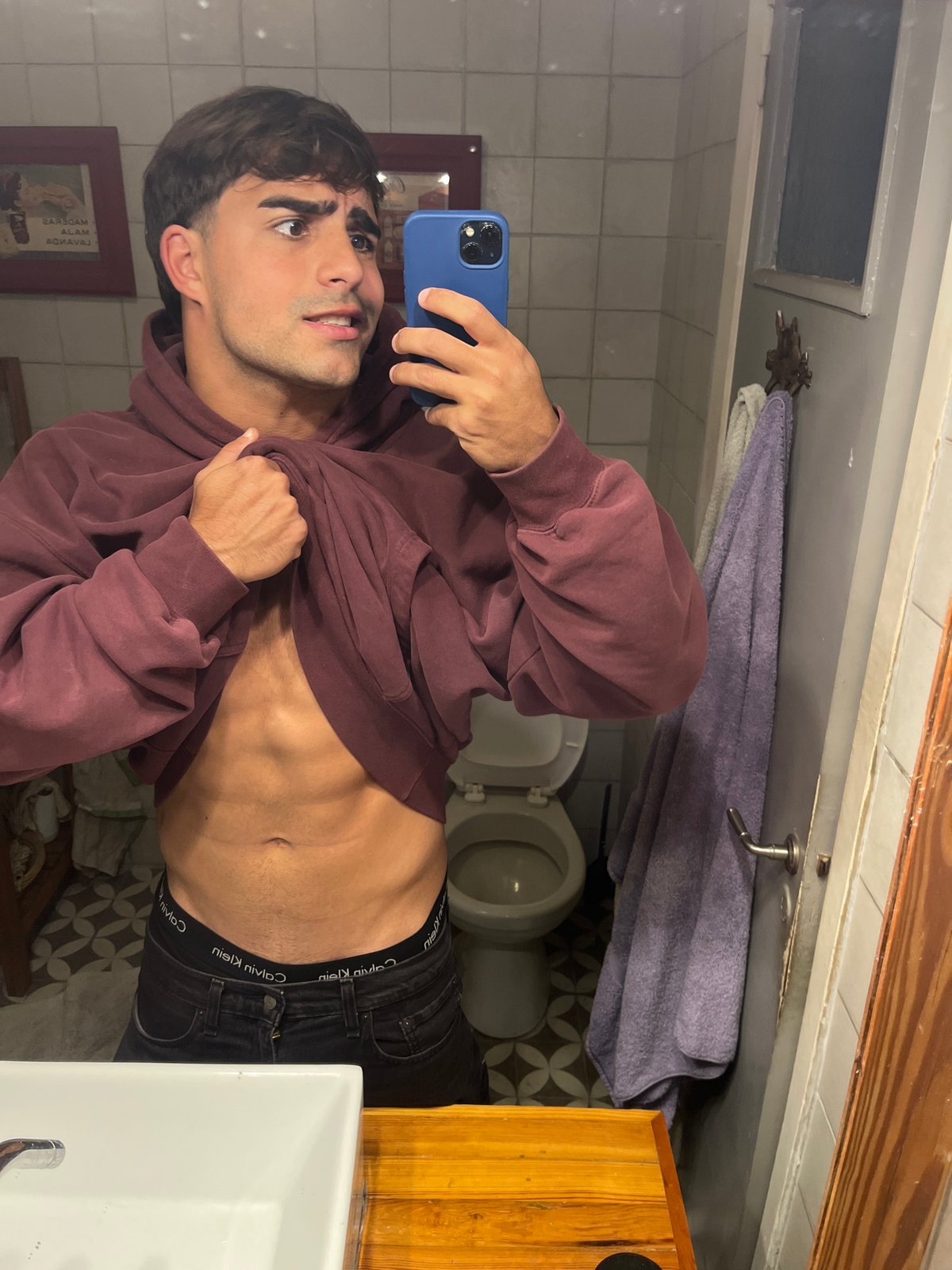 Young man takes bathroom selfies in Avellaneda, Argentina