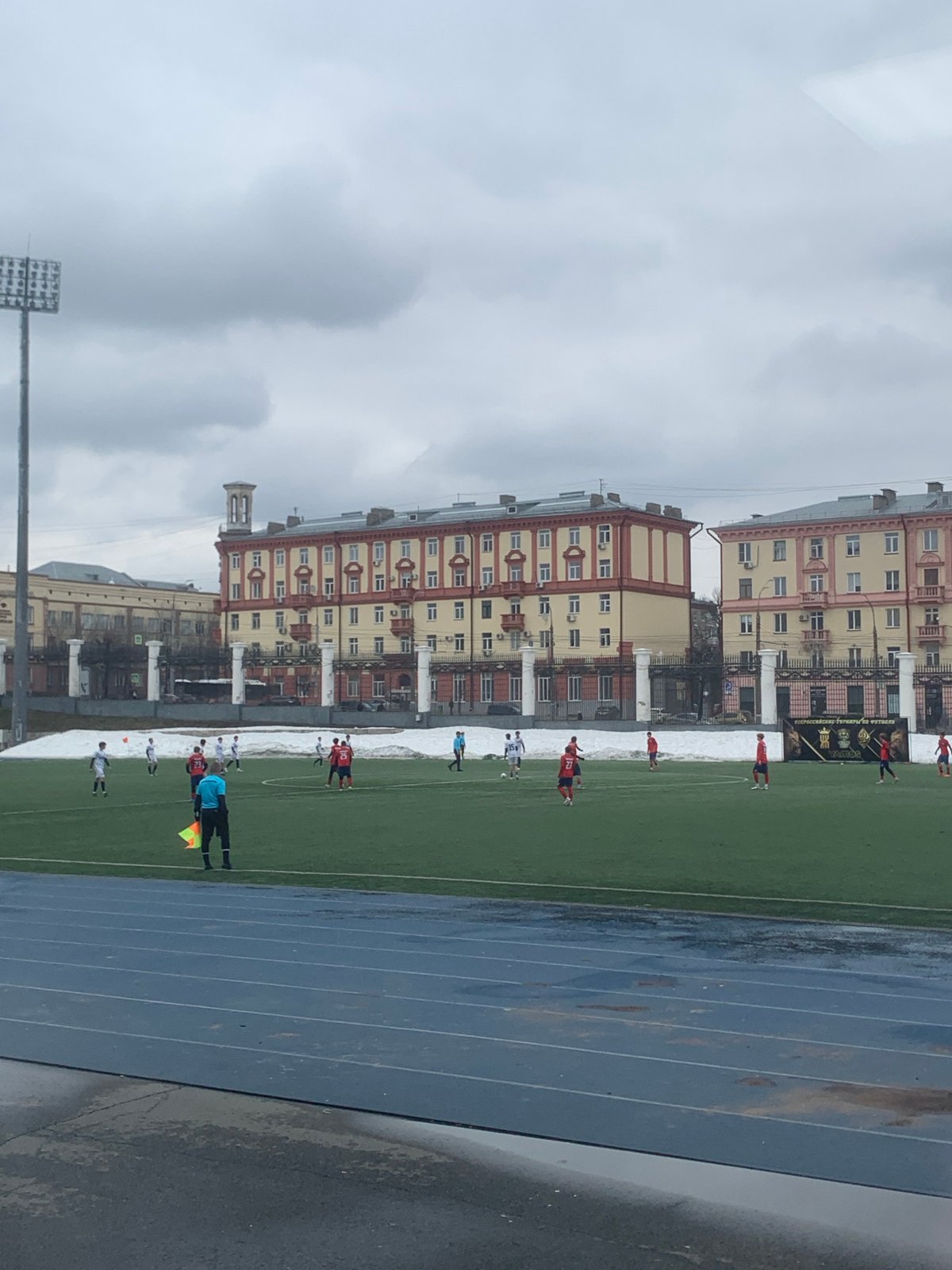 Soccer match underway in Izhevsk under overcast skies
