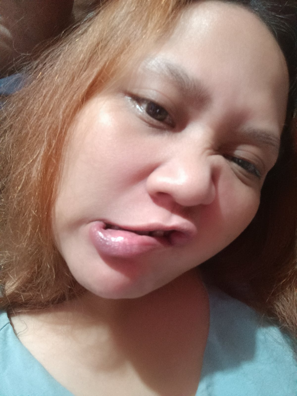Woman documents evening routine with selfies and drinks in Depok